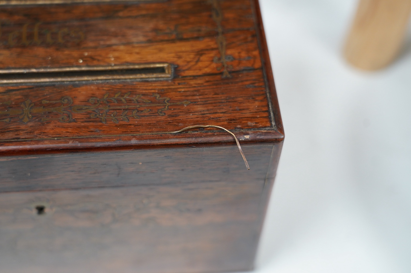 A George IV cut brass inlaid rosewood ‘letters’ box, satinwood interior, 23cm wide. Condition - fair